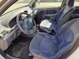 the interior of a car with a blue seat cover and a steering wheel