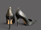 two pairs of black high heel shoes with a zipper on the side