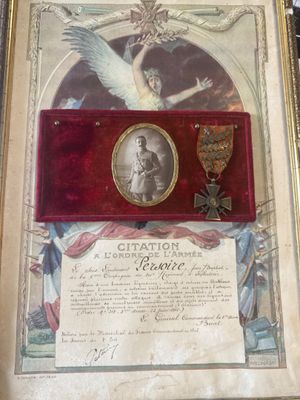 an old picture of a plaque with a picture of an angel and a medal