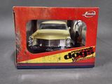toy car in a box on a gray surface with a horse