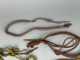 a rope that is tied to a hook on a white surface