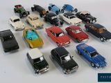 a lot of toy cars that are sitting on a table