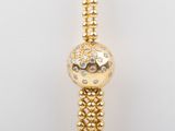 an image of a close up of a bracelet with gold beads