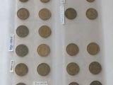 a lot of coins in a plastic bag on a table