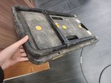 a person holding a piece of luggage in their hand