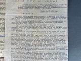 an old newspaper with a piece of paper on top of it next to another piece of paper