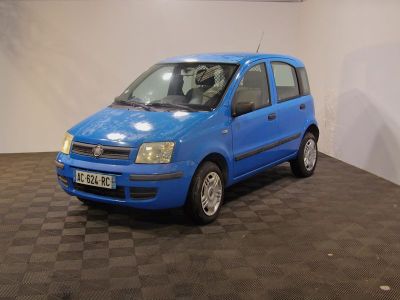 a small blue car that is parked in a room