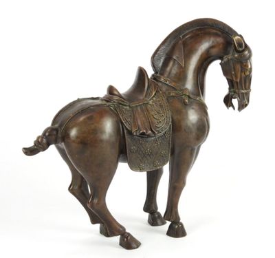 bronze statue of a horse with a saddle on it ' s back