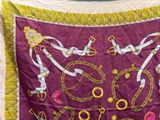 a purple banner with gold chains and chains on it