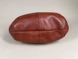 an image of a brown leather bag on a white background