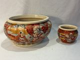 two vases sitting next to each other on a white surface
