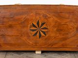 an image of a wooden box with a flower design on it
