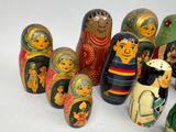 a lot of russian nesting dolls on a white surface
