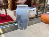 a vase that is sitting on a glass table