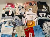 a lot of clothes that are sitting on a table