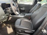 the interior of a car with black leather seats and a steering wheel