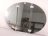 a mirror that is sitting on a shelf in a room