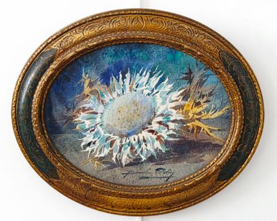 une photo d'un tableau représentant un tournesol dans un cadre doré