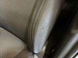 a close up of a seat in a car with a hole in it