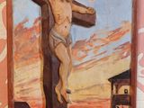 un tableau représentant Jésus sur la croix, accroché au mur