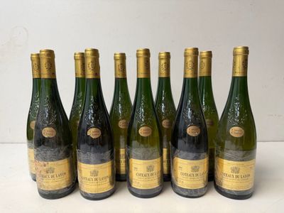 six bottles of wine are lined up in a row on a table