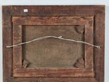 a close up of a wooden frame with a barbed wire around it