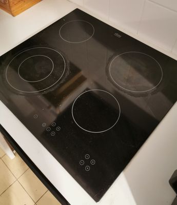 a black and white stove top in a kitchen