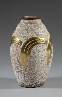 a white vase with a gold decoration on it