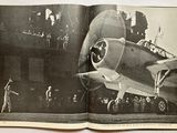 an open book with a picture of a plane on it