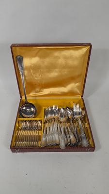 a box with silverware in it on a white surface