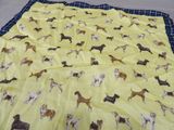 a blanket with dogs on it on the floor