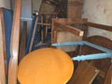 a table and chairs in a room with a lot of furniture