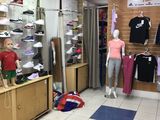 a store with mannequins and clothing on display