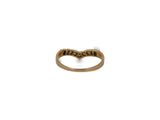 a close up of a gold ring on a white background