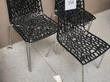 two chairs that are sitting next to each other