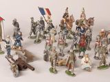 a lot of figurines that are on a white surface