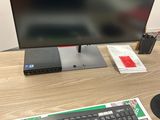 an image of a computer desk with a keyboard and monitor