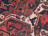 an image of a close up of a rug with a red and blue design