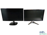 two monitors sitting side by side on a white surface