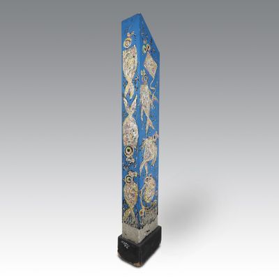 an image of a blue and gold sculpture of a bird on a branch