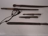 several different types of weapons are displayed on a white surface