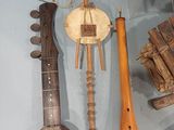 a display of musical instruments on display in a glass case