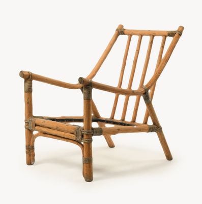 a chair made out of bamboo sticks on a white background