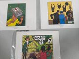 three comics are sitting on a table with a person holding a cell phone