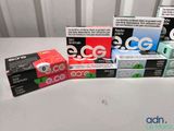 several boxes of cigarettes sitting on top of a table next to each other