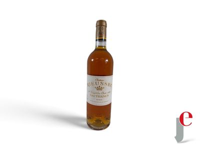 a bottle of wine sitting on top of a white surface