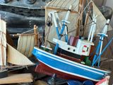 a small boat that is sitting next to other small boats
