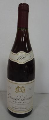 a bottle of wine that is sitting on a table