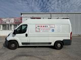 a white van that is parked in a parking lot