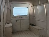 an image of the inside of a van with the door open